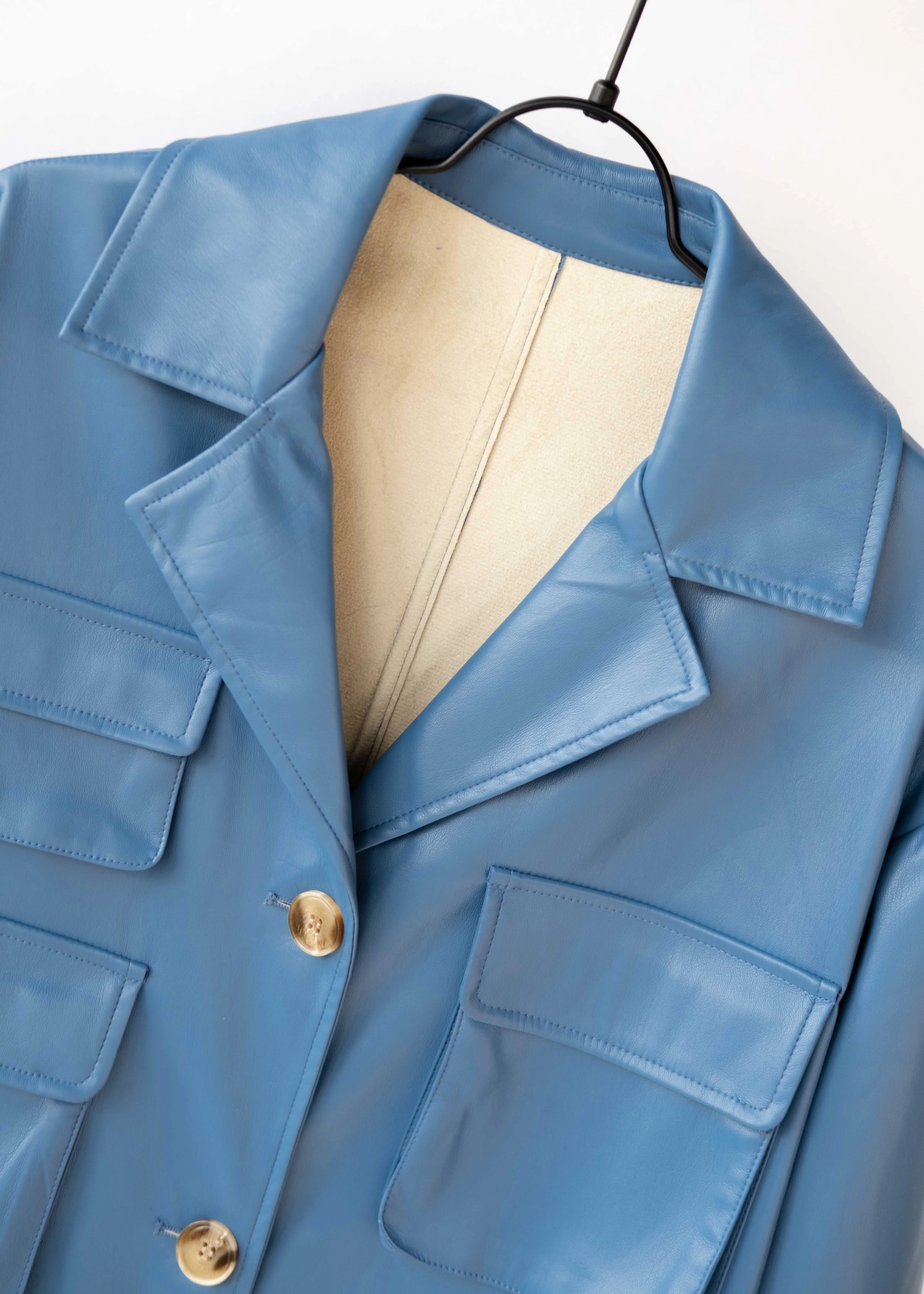 Modern coat made of vegan leather