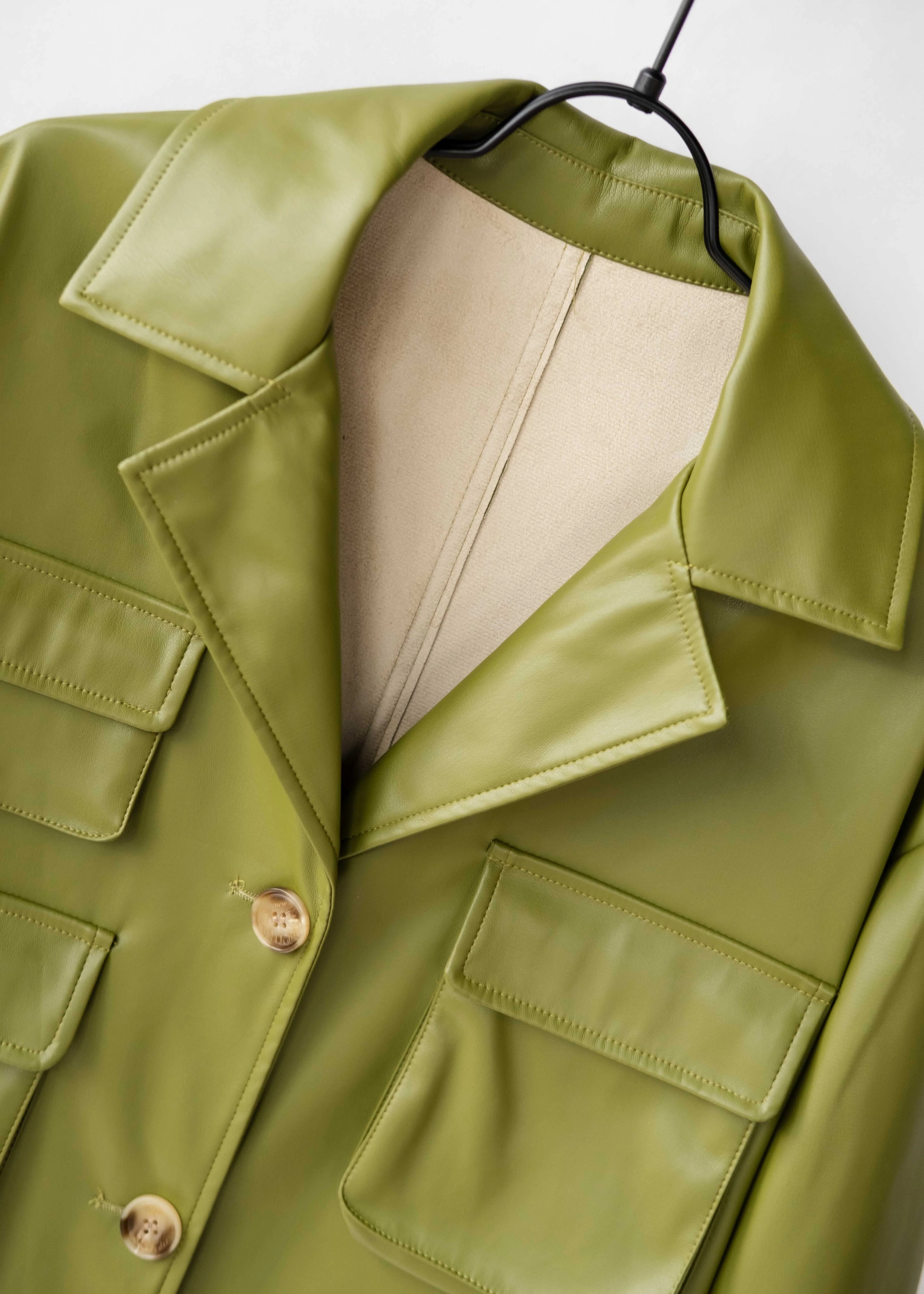 Modern coat made of vegan leather