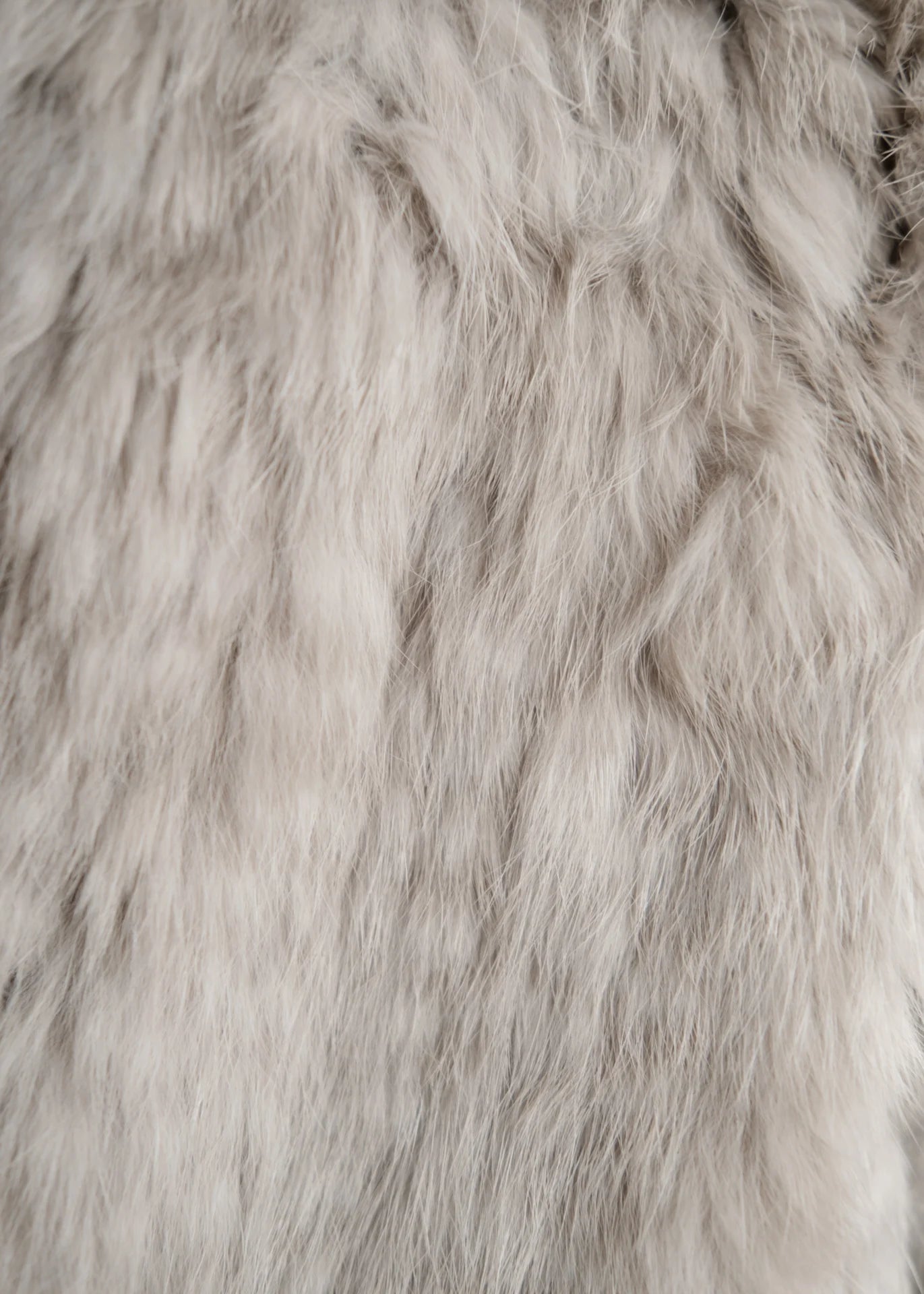 Ärmelloser Mantel aus Kaninchenfell