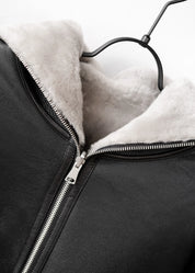 Manteau long en peau lainée à capuche