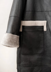 Manteau long en peau lainée à capuche