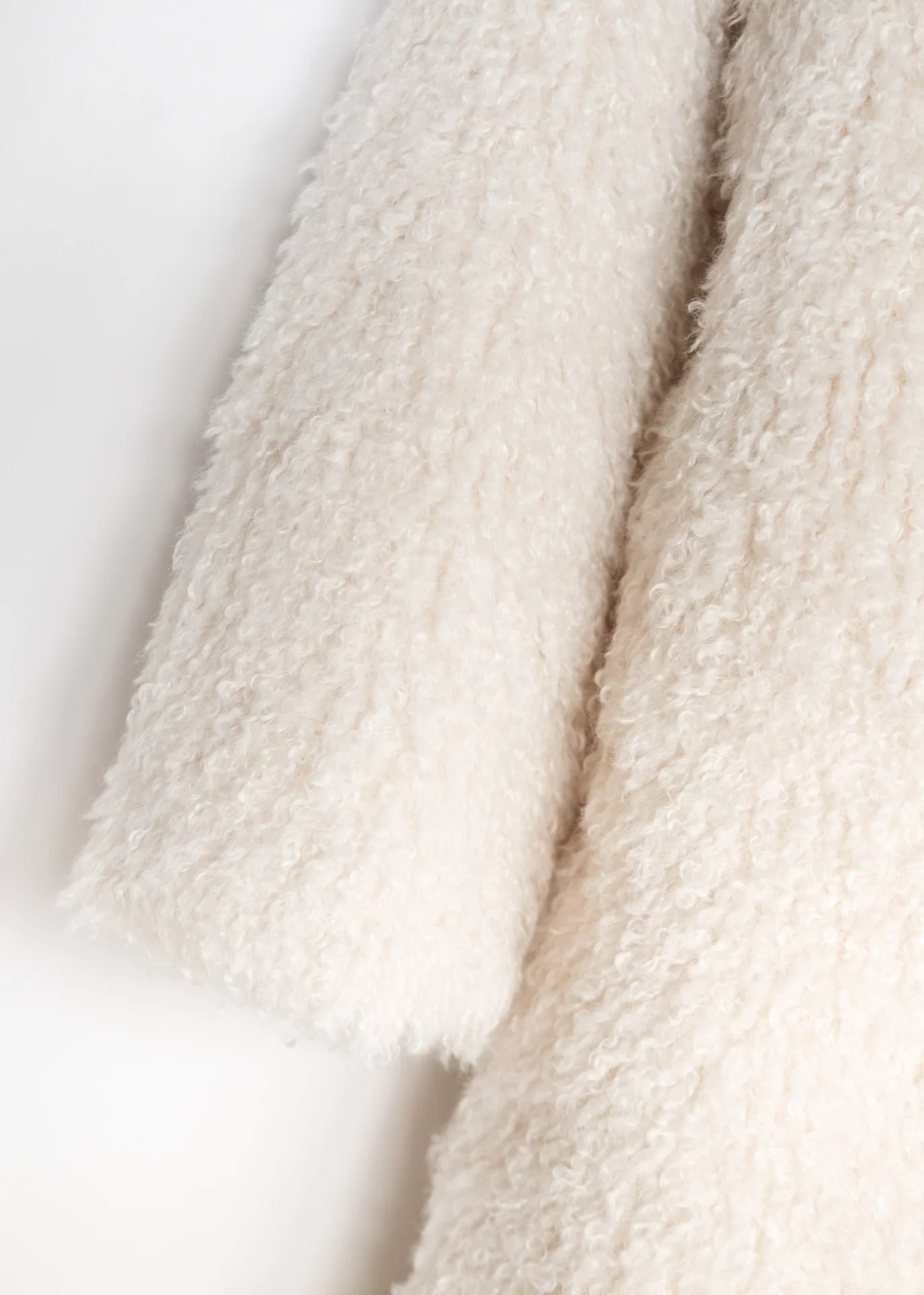 Lockiger Faux Fur Mantel